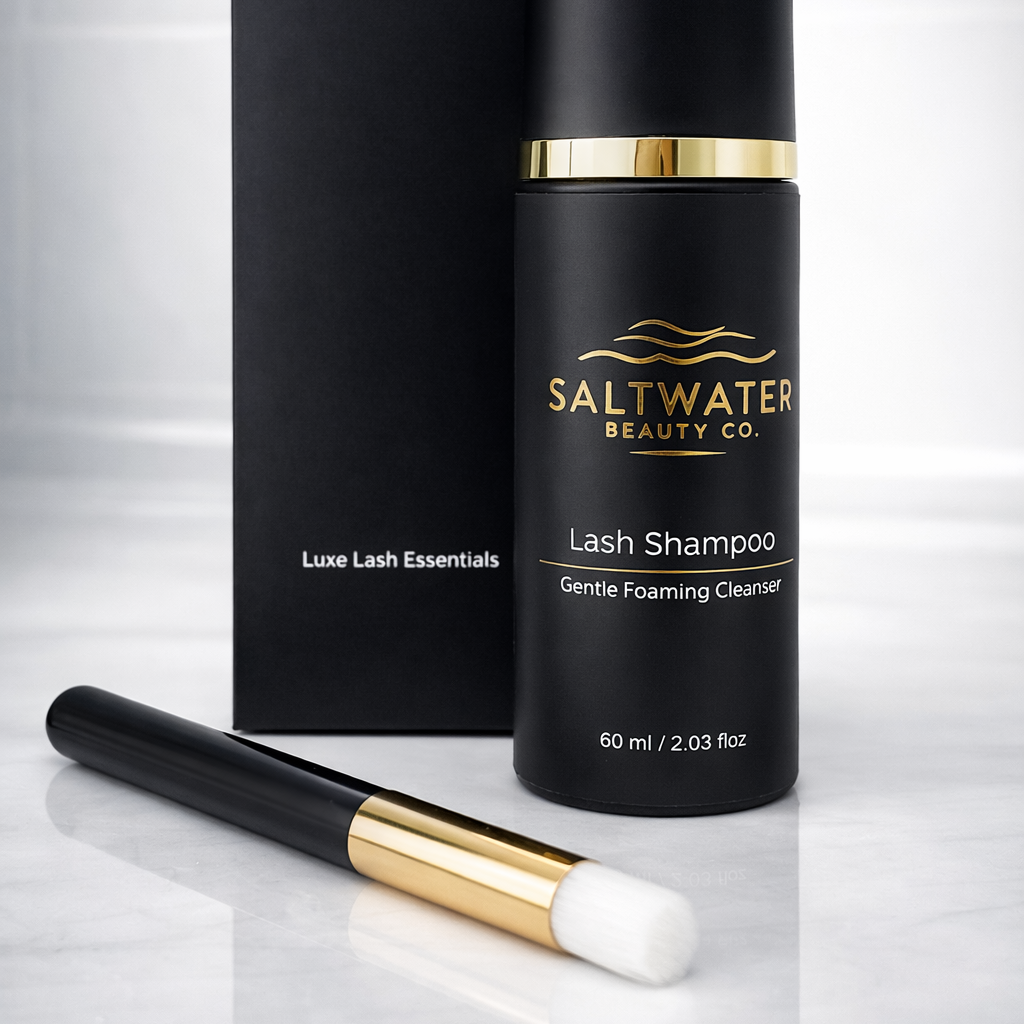 Saltwater Beauty Co. lash shampoo bottle with applicator and packaging on a white background